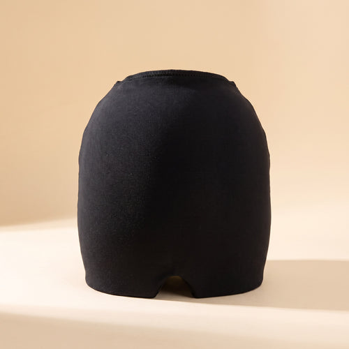 Danevy Relief Cap in black on a cream background